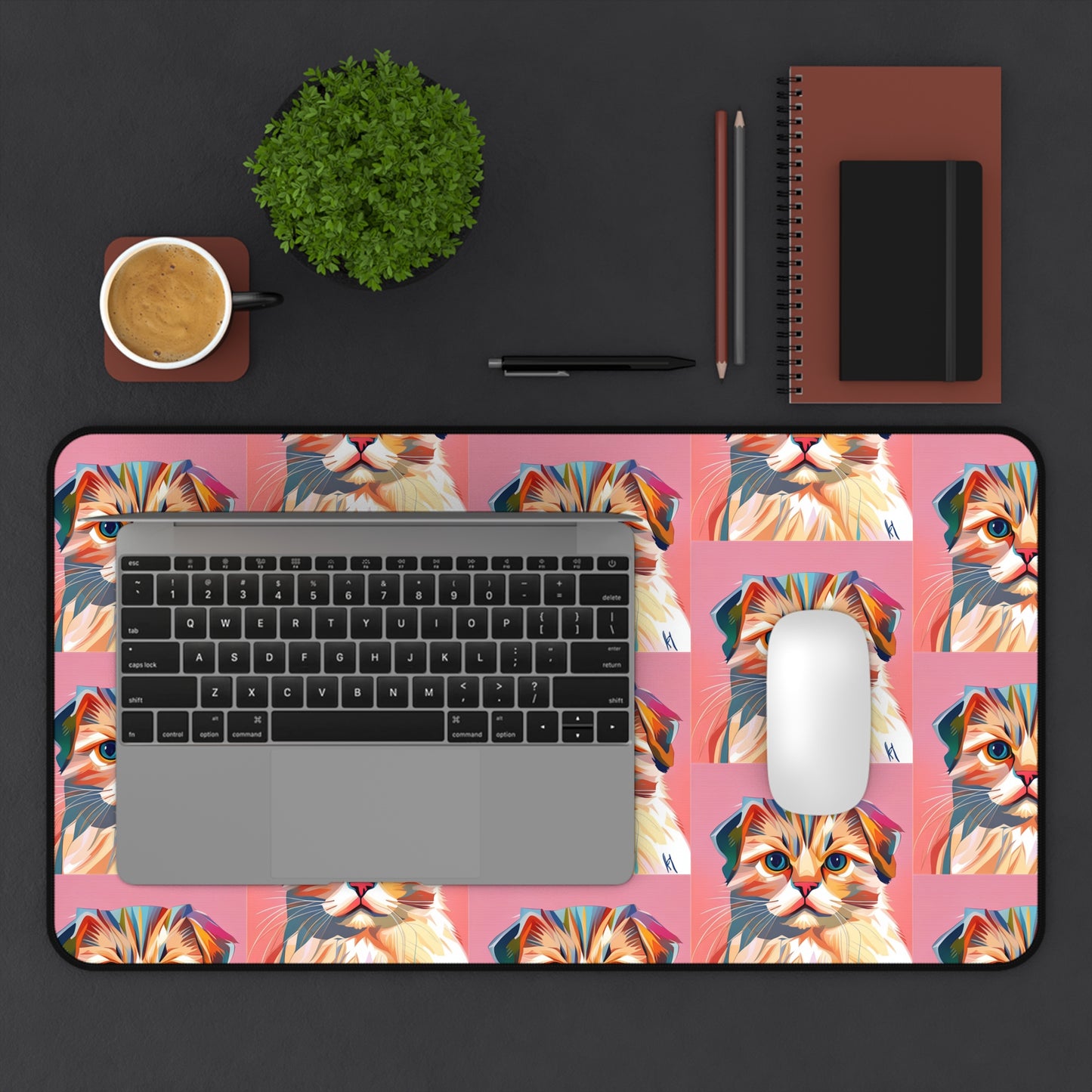 Custom desk mat with colorful cat design, laptop, mouse, and coffee on workspace.