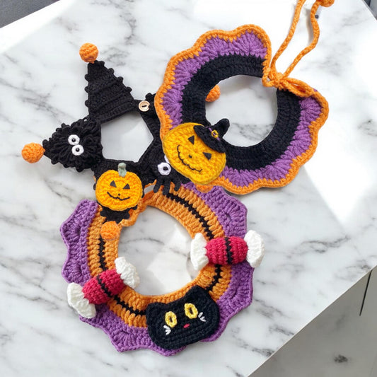 A handcrafted pet collar, with Halloween elements like pumpkins, black cat, trick or treat candies